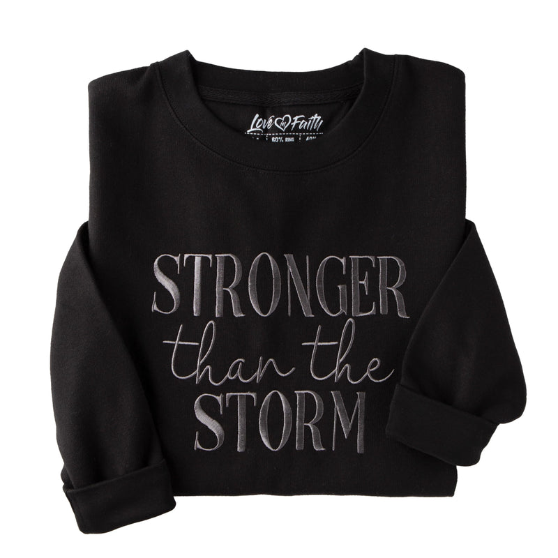 Love in Faith | Stronger Than The Storm Embroidered Sweater | Christian Crewneck Sweatshirts | Faith-Based Apparel | Unisex (US Alpha 3X-Large Regular Regular Black)